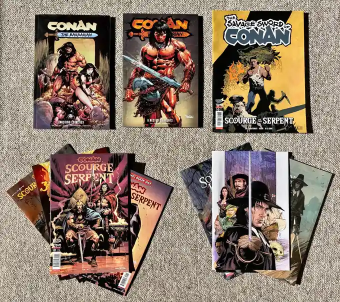 Conan and Solomon Kane comic collection with variant covers displayed together